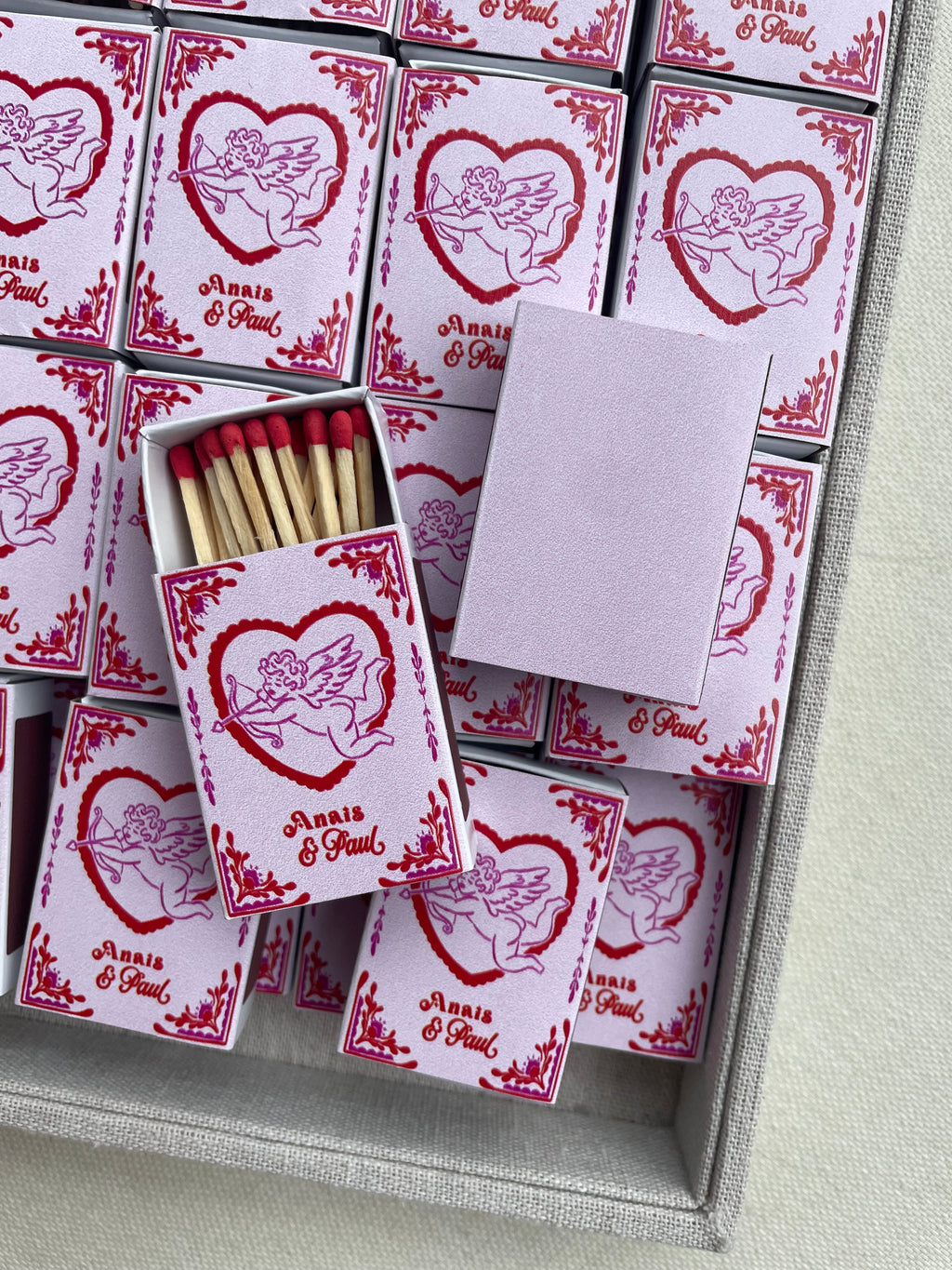 Personalized wedding favor matchboxes with cupid design