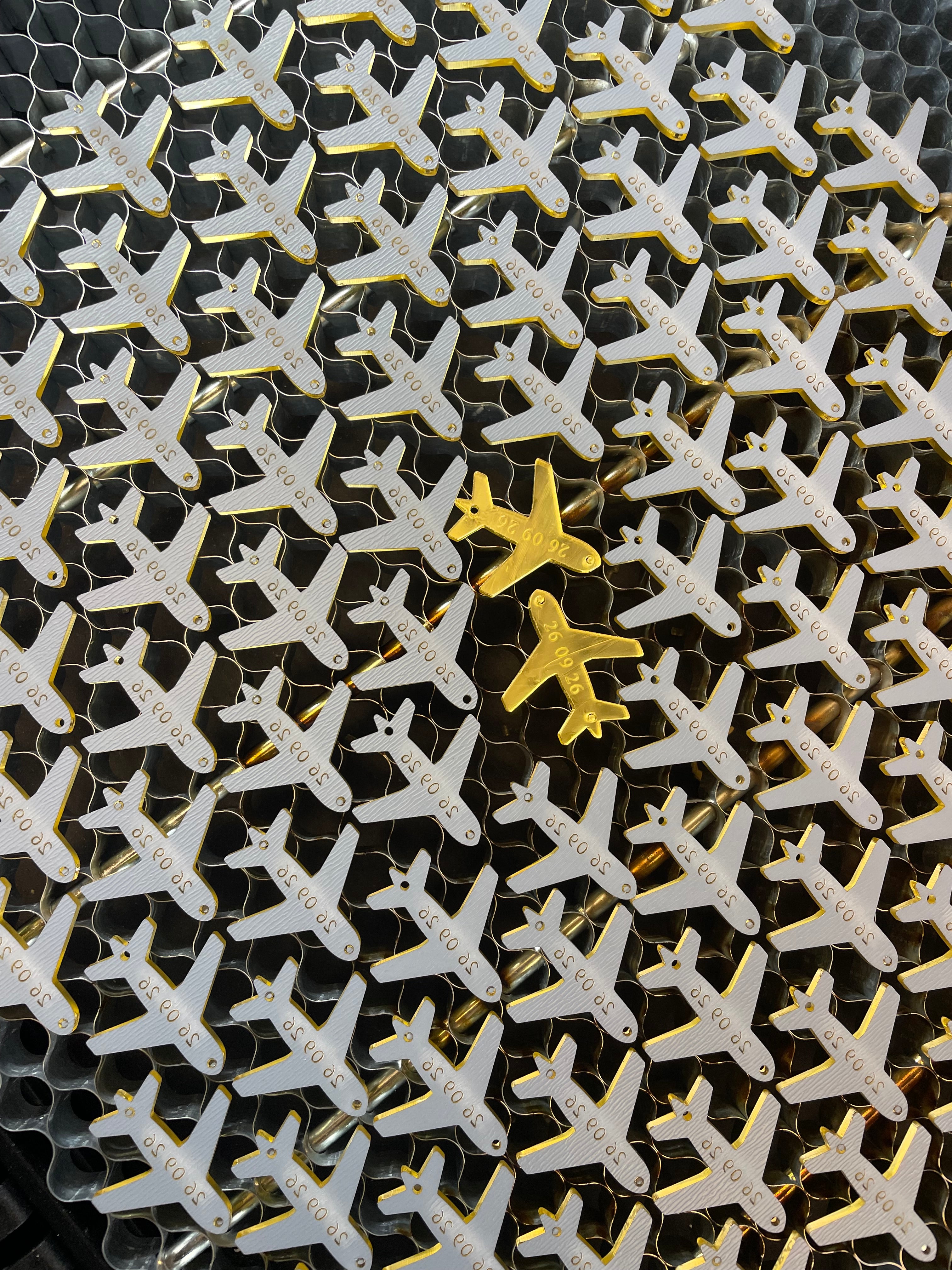 Laser cut acrylic airplane charms for weddings