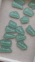 Sea glass wedding place cards with elegant calligraphy for table seating